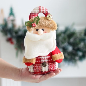Christmas Santa doll ornament with red plaid fabric, golden bell, and plush detailing