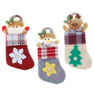 Three linen Christmas stockings with Santa, Snowman and Reindeer motifs for holiday decor