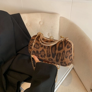 Vintage leopard print evening bag with sparkling rhinestones and a gold chain strap