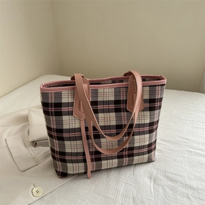 Pink and black checkered tote bag with leather straps for daily commute and school