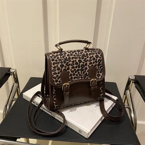 Chic leopard print mini backpack for women with vintage brown leather trim and metal buckle