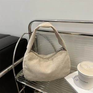 Chic beige corduroy hobo shoulder bag for women with minimalist aesthetic and zip closure