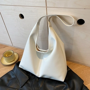 Minimalist cream white hobo tote bag in premium faux leather with a wide shoulder strap