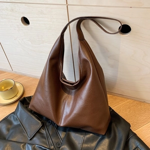 Minimalist large brown leather tote bag for women showing a stylish shoulder bag design