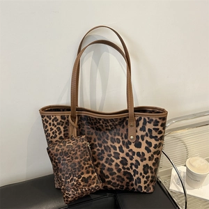 Fashionable leopard print tote bag set with brown leather handles and matching pouch