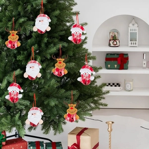 Christmas tree ornaments set featuring plush Santa, snowman, and reindeer with red bells