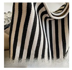 Close-up of high-quality striped canvas texture and premium weave detail on tote bag