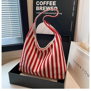 Close-up of red and white striped canvas tote bag showing the thick knit fabric texture