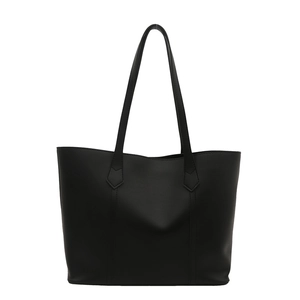 Large black minimalist PU leather tote bag with sturdy reinforced shoulder straps on white background