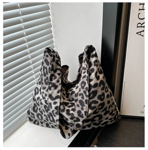 Detailed view of leopard print tote bag with thick textured knit fabric and relaxed shape