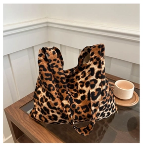 Close-up of leopard print tote bag with corduroy texture and sturdy wide shoulder strap