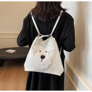 Detailed back view of a white PU leather backpack featuring a plush dog patch on the strap
