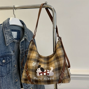 Brown plaid canvas tote bag with cartoon dog print and leather straps in retro style