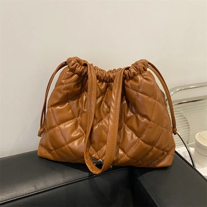 Quilted caramel brown PU leather tote bag with drawstring closure and large capacity