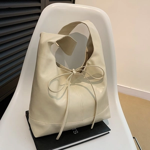 Minimalist cream-white PU leather hobo bag with delicate bow knot detail and large capacity