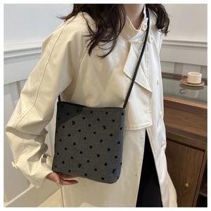 Chic grey canvas bucket bag with black polka dots and delicate bow embroidery details