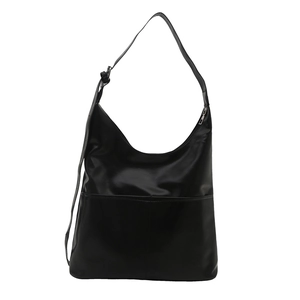 Minimalist black faux leather tote bag with adjustable shoulder strap and spacious interior