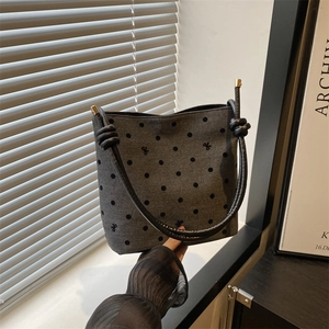 Chic dark gray canvas bucket bag with black polka dots and bow embroidery details