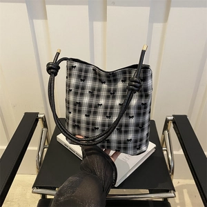 Minimalist black and white plaid bucket bag with bow embroidery and knot handle
