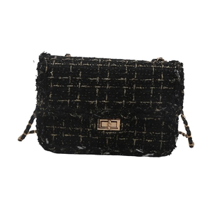 Classic black tweed chain bag with gold metallic threads and rectangular twist lock