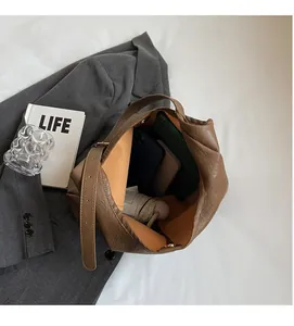 Detailed view of brown leather tote interior showing spacious capacity for daily items