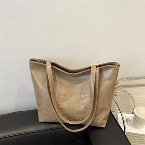 Retro khaki tote bag with 3D embossed skeleton ribs design in matte leather texture