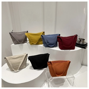 Multi-color nylon shoulder bags display with zip closure and crinkled texture fabric