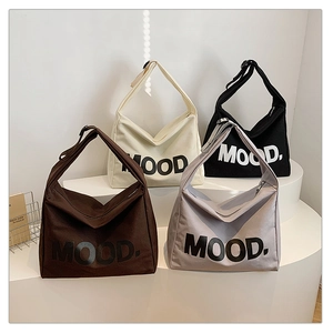 Selection of four colors of large canvas tote bags with MOOD print and adjustable straps