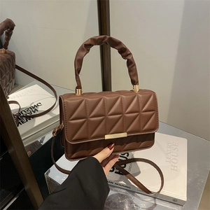 Brown quilted leather handbag with gold metal clasp and ruched handle for women