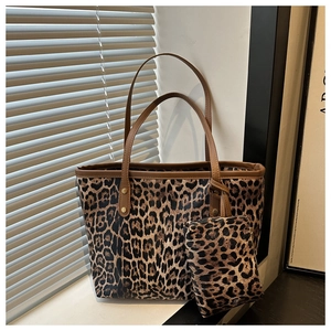 Detailed view of leopard print tote bag set with brown PU trim and gold rivet accents