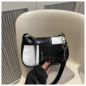 Detail of color-block shoulder bag with flower metal chain and fashion print logo