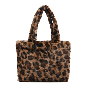 Faux fur leopard print tote bag with soft plush texture and dual carry handles