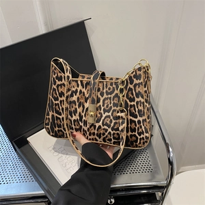 Leopard print handbag with gold chain strap and metallic twist lock for women