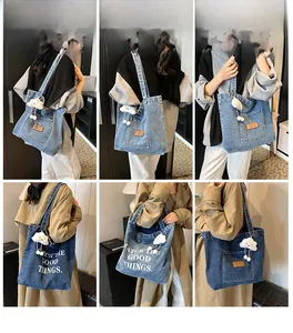 Detail of denim tote bag showing vintage leather patch and cute cloud plush accessory