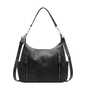 Large matte black tote bag with dual zippers and side pockets for women commuters