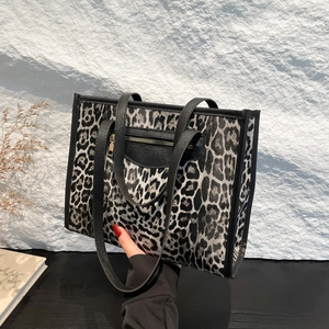 Large capacity leopard print tote bag with black leather trim and metal zipper detail