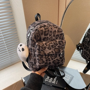 Mini leopard print backpack with panda plush charm and black straps for fashion casual look
