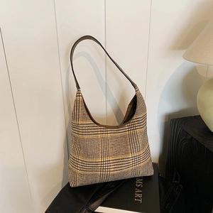 Classic plaid hobo shoulder bag with brown leather strap and vintage woven texture