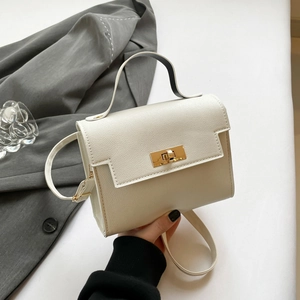 Chic cream Saffiano leather mini Kelly style handbag with gold buckle for women