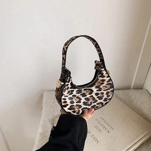 Chic crescent leopard print mini handbag with smooth zipper and curved top handle