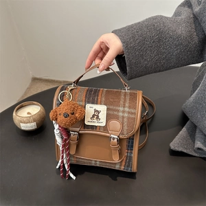 Retro plaid woolen handbag with brown leather trim and a cute plush bear charm