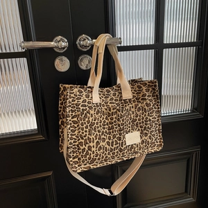 Large vintage leopard print canvas tote bag with twin handles and adjustable strap