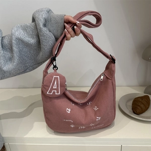 Pink corduroy crescent bag with letter embroidery and round coin purse charm