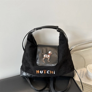Minimalist black tote bag featuring cute dog embroidery and stylish leather拼接 trim
