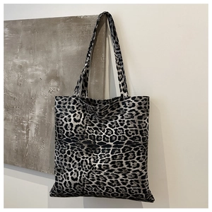 Close-up of the large leopard print canvas tote bag with black and white texture