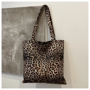Detail of the leopard print pattern and fabric texture on a large tote bag