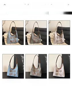 Detail view of large capacity tote bag in blue, black, and beige with WIO WIO logo