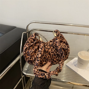 Vintage leopard print pleated crescent bag with gold metal hardware and soft texture