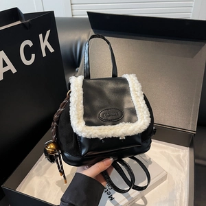 Mini black and white patchwork faux shearling backpack for women with fashion embossing