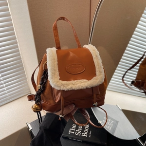 Mini caramel faux leather backpack with fuzzy fleece trim and fashion logo label